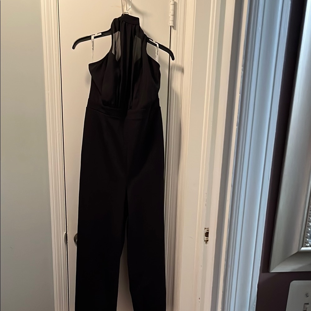 JJs House Black Sleeveless Jumpsuit with High Neckline